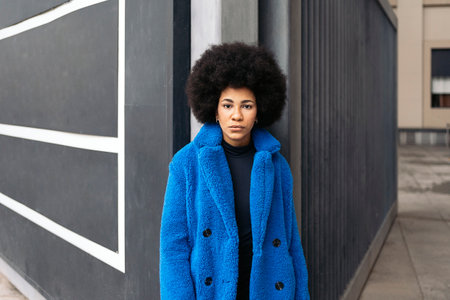 Stock photo of beautiful african american girl posing and looking at camera.の写真素材