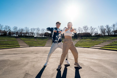 Stock photo of cool girl and her friend practicing their dance moves and having fun.の写真素材