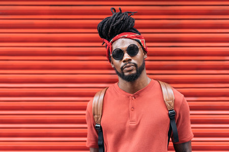 Stock photo of attractive and young african american boy wearing sunglasses. He is looking at camera.の写真素材