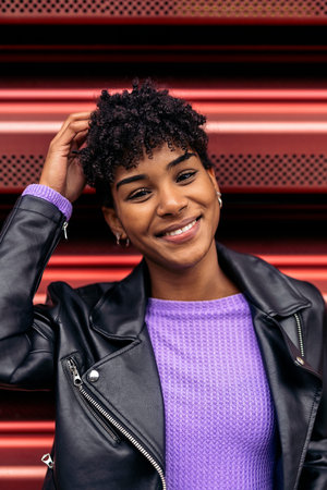 Stock photo of cool african girl smiling and looking at camera.