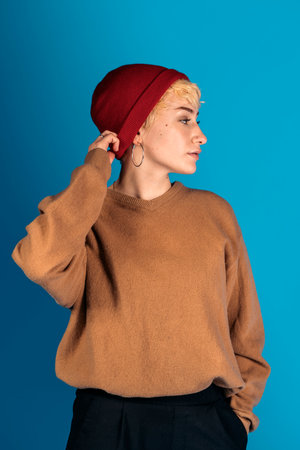 cool woman with hat in studioの写真素材