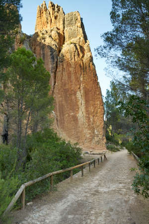 a path between the rocks and the riverの写真素材