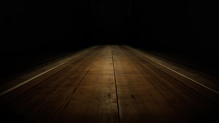 A dramatic perspective view showcases a dark wooden floor bathed in shadow, creating a moody and visually compelling background. The dark tones and strong shadow play, accented by focused light, highlight the texture and grain of the wood. This image offers a striking abstract pattern with ample empty space, making it ideal for design projects, interior visualizations, or a striking stage setting. The brown hues and hardwood appearance suggest a sense of depth and natural material.の素材