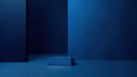 A striking minimalist composition showcases a collection of blue objects and geometric lines arranged in a monochromatic setting. The abstract design features a range of blues, including indigo and navy tones, against a clean studio background. This contemporary image is ideal for modern interior design projects, product showcases, or as an aesthetic backdrop. Its simplicity and use of space also lends itself to digital art and creative advertising campaigns.の素材