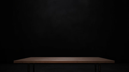 Showcase your products with this elegant image of an empty wooden table set against a sophisticated black background. This high-quality, isolated shot provides the perfect template for product display and advertisement presentations. The wooden surface offers a clean, modern, and minimalist aesthetic, with ample copy space for text or design elements. Ideal for commercial and promotional use, this horizontal image is a versatile asset for creating stylish visual content.の素材