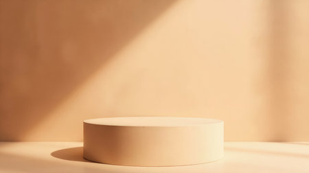 Clean, minimalist beige backdrop featuring a cylindrical product display stand, perfect for showcasing your product in advertising or branding materials.  Ideal for a modern, elegant presentation.  Includes subtle shadow and soft lighting effects.  Suitable for mockups and templates.の素材