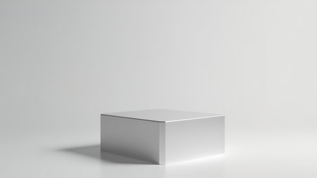 Clean, minimalist 3D render of a silver cube display platform, perfect for showcasing products or branding.  Ideal for websites, marketing materials, and presentations.  The isolated white background ensures a professional and versatile image, easily adaptable to various design projects.  Empty and ready for your product.の素材