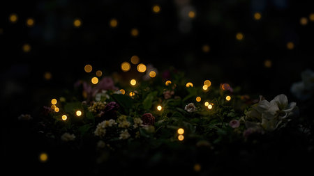 Dark background with bokeh lights over flowers and foliage in shades of green, white, and pink.の素材