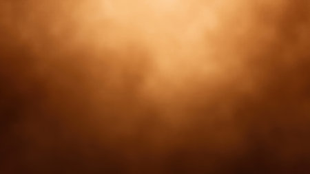 Warm brown and orange gradient with a soft blurred effect creates an abstract background.の素材