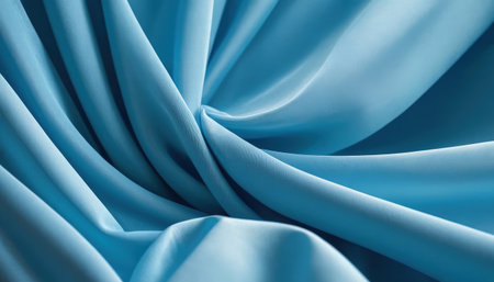 close up of blue satin fabric texture background with some folds in itの素材