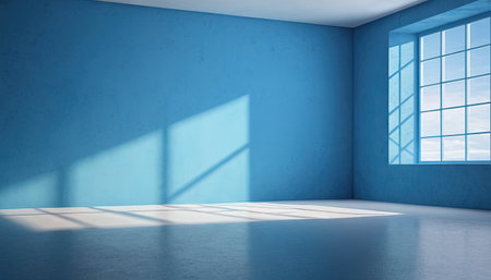 Interior of empty room with blue walls, concrete floor and window with sunlightの素材