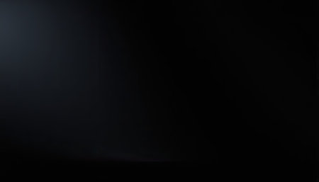 Black studio background with spotlight and copy space for text or image.の素材