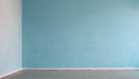 Empty room with blue wall and concrete floor. Empty room for your design.の素材