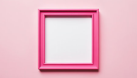 Pink picture frame on pink background. Empty space for your text.の素材