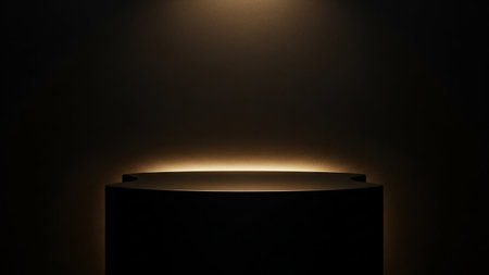 Round podium illuminated with spotlights in dark room. 3D renderingの素材