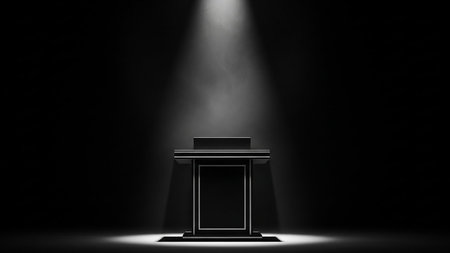 Podium and spotlight on a black background. 3D Renderingの素材