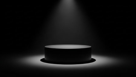 Black round podium on a black background. 3d render illustration.の素材