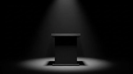 Black podium with spotlight on a black background. 3D rendering.の素材