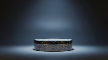 3d render of a round podium on a dark background with a spotlightの素材