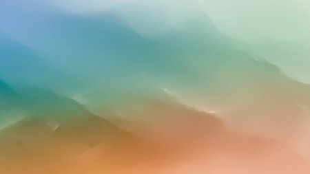 A soft, abstract background with a smooth gradient of colors transitioning from blue and teal to green and orange. The texture resembles wispy clouds or mist, creating a calm and atmospheric visual. Clear details and vibrant colors enhance visual appeal.の素材
