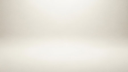 A soft, textured background in a light beige or cream color. The lighting is subtle and diffused, creating a gentle gradient from a brighter top to a slightly darker bottom, suggesting a studio or empty space. The texture is fine and consistent.の素材