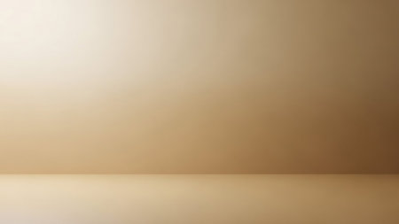 A smooth, empty studio space with a gradient of soft beige tones. The wall and floor meet at a subtle corner, illuminated by diffused light.の素材