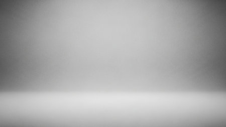 A plain, empty grey studio background with a soft gradient and subtle lighting, creating a clean and neutral space.の素材
