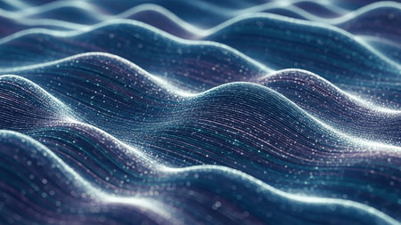 An abstract digital landscape of smooth, glowing blue and purple waves adorned with tiny, sparkling light particles.の素材