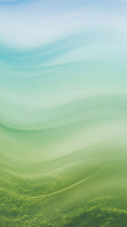 An abstract, wavy background with soft blending of blue, teal, and green tones creates a serene and organic feel.の素材