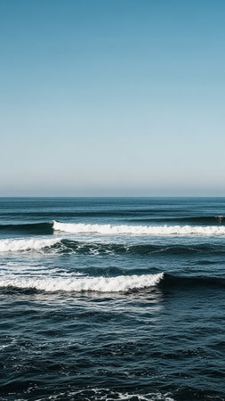 Outdoors showing deep blue ocean waves crashing under a clear sky keywords: ocean, sea, water, waves, ocean waves, sea waves, crashing waves, ocean surface, sea surface, blue, deep blue, clear...の素材