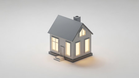 A stylized 3D isometric illustration of a small, gray house with a pitched roof, chimney, and warmly lit windows, set against a white background.の素材