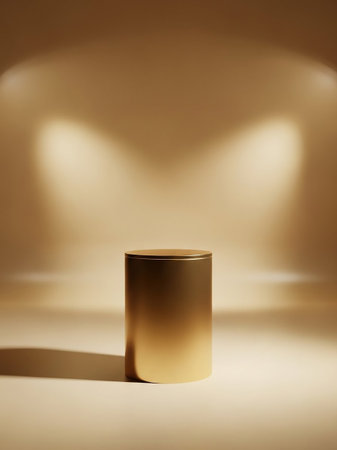 A simple gold cylinder pedestal stands on a neutral surface, bathed in soft, warm spotlight illumination creating a minimalist and elegant display setting.の素材