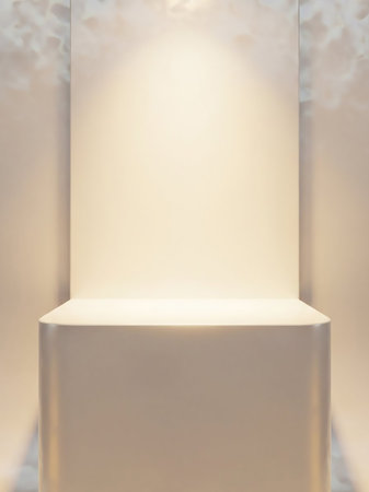 A minimalist white display stand with a smooth surface, softly illuminated by a spotlight from above, creating a clean and elegant presentation space.の素材