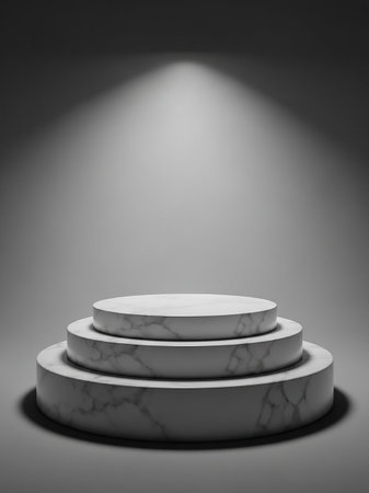 A three-tiered marble podium illuminated by a single spotlight from above, set against a dark, gradient background.の素材