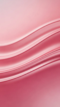 Smooth pink silk fabric flows in gentle waves, creating a soft and luxurious texture with a subtle sheen under soft lighting.の素材