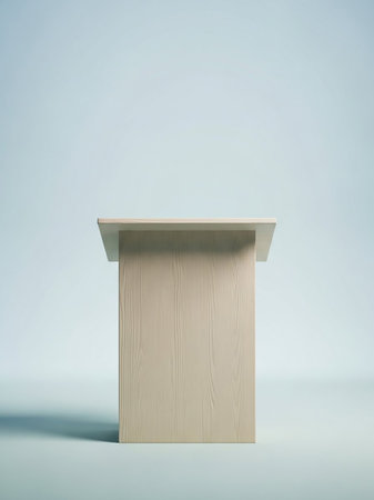 A light wood podium with a textured surface stands centered against a soft, gradient blue background with subtle lighting and shadow.の素材