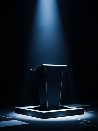 A sleek, futuristic podium is dramatically lit by a blue spotlight from above, resting on an illuminated platform in a dark, atmospheric setting.の素材