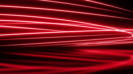 Abstract red neon light streaks curve and flow, creating a sense of speed and a tunnel effect against a dark background.の素材