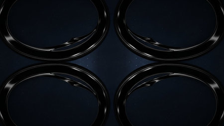 Four dark, glossy metallic rings are arranged in a symmetrical pattern against a deep blue, starry background with subtle light reflections.の素材