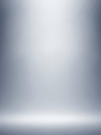 A clean, bright studio background a soft spotlight illuminating the space. Subtle grey and white gradients create a smooth, and versatile backdrop.の素材