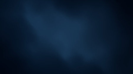 A dark navy blue abstract background featuring soft, subtle light gradients and a hint of texture, creating a calm and atmosphere.の素材