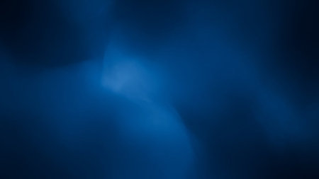 A soft, blurred gradient of deep blue hues with subtle areas of lighter luminosity, creating a calm and atmospheric abstract background.の素材