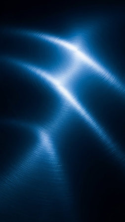 A dark blue brushed metal surface is illuminated by bright, glowing light streaks creating a sense of energy and motion.の素材