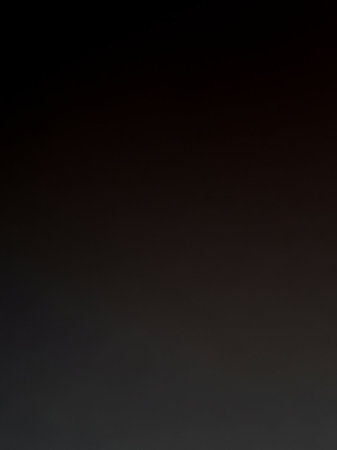 Simple showing a deep, dark brown to black gradient background with a very subtle texture and a hint of light at the keywords: dark, brown, black, gradient,...の素材