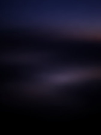 Stock showing a dark, abstract background with a subtle horizontal band of soft purple and white light creating a moody and atmospheric visual effect keywords:...の素材