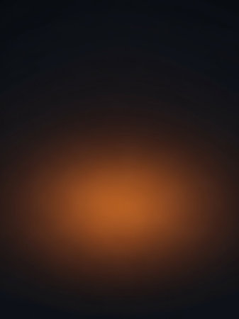 A dark charcoal gray abstract background with a bright, warm orange spotlight emanating from the center, creating a strong focal point.の素材