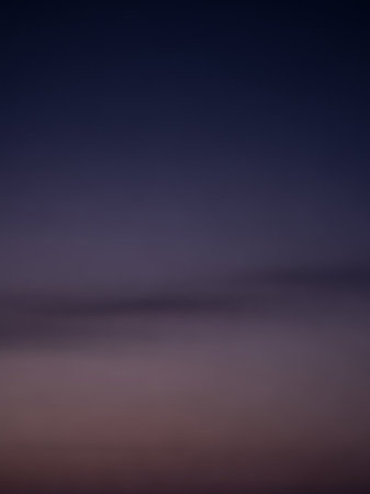 Stock showing a gradient sky transitioning from deep indigo blue at the to soft lavender and muted purple hues at the horizon during twilight. keywords: sky,...の素材