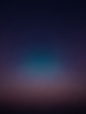 Stock showing a smooth, dark gradient background transitioning from deep navy blue at the to soft purple and dark gray at the bottom with a subtle teal glow in the...の素材