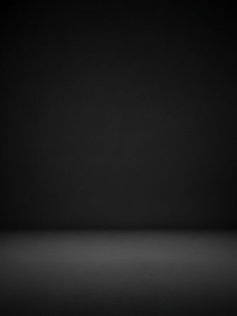 A seamless dark grey studio background a subtle gradient and a soft shadow on the floor, creating a minimalist backdrop.の素材