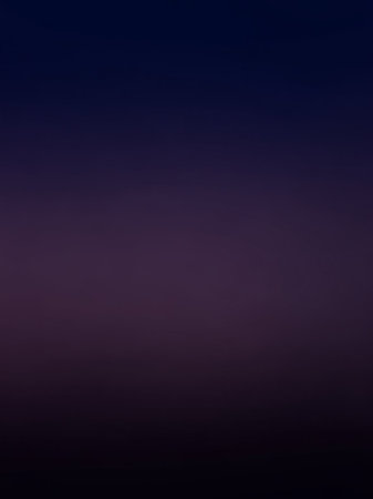 A deep, dark gradient background transitioning from indigo blue to black, creating a moody and atmospheric abstract backdrop.の素材